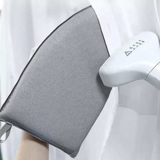 Highly insulated hand held iron pad.