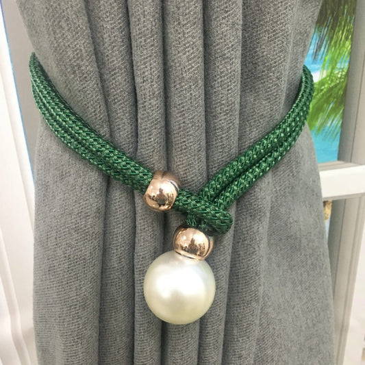 A PAIR OF ELEGANT CURTAIN HOLDERS